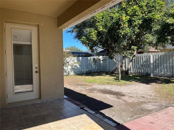 a view of a backyard of the house