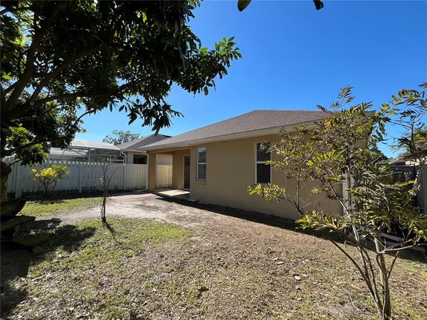 a backyard of a house with lots of green space