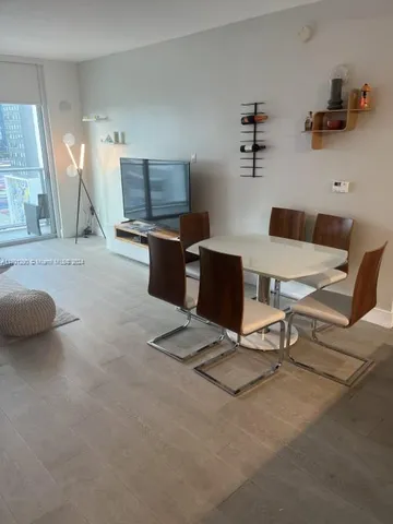 a living room with furniture and a lamp