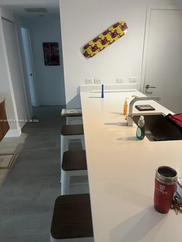 a living room with a couch and a mirror