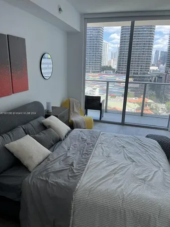 a kitchen with granite countertop a stove and a cabinets