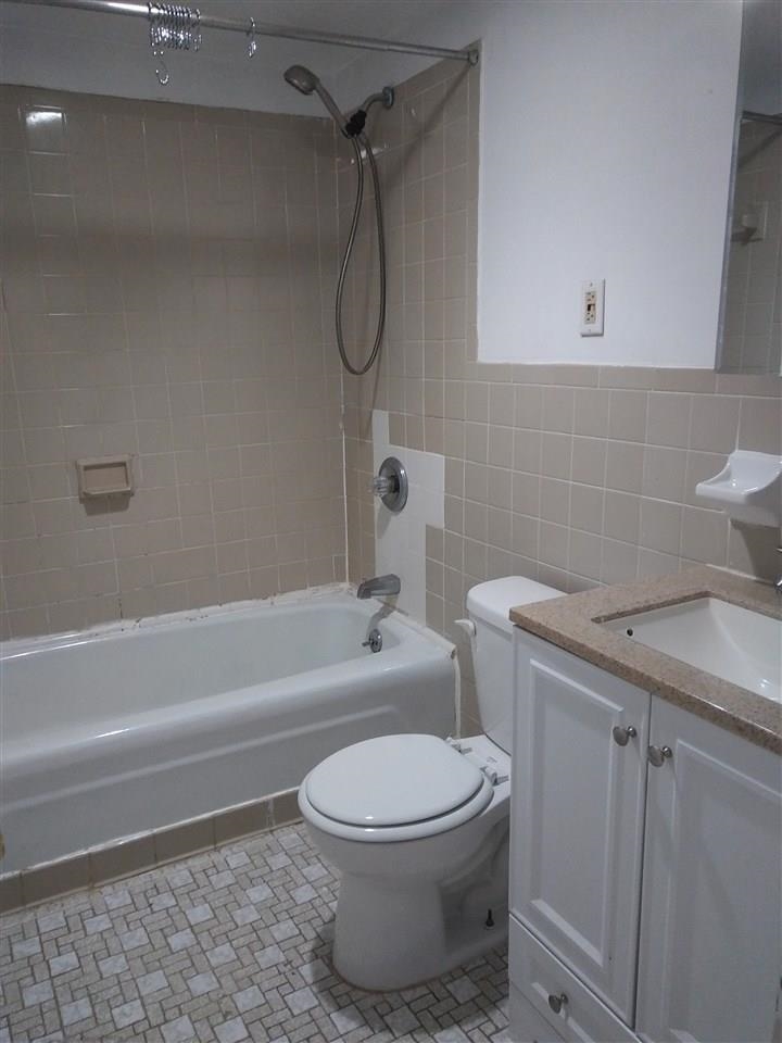220 Garden Street, Unit 1(GRND) Hoboken, NJ 07030 - Photo 6 of 9 a bathroom with a toilet and a shower