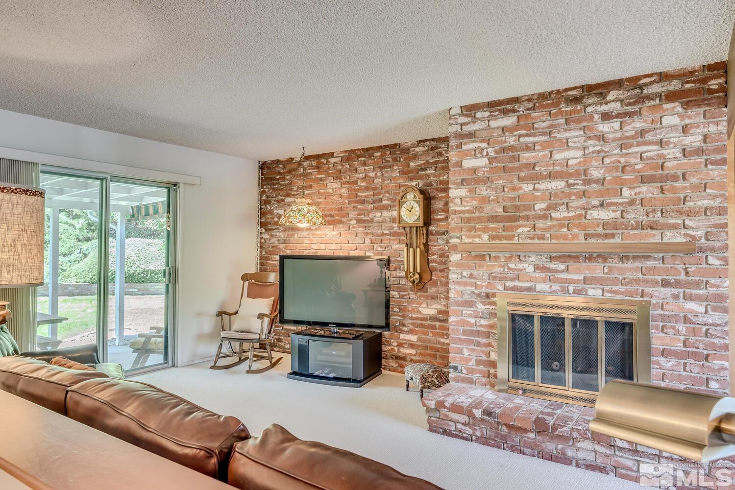 1290 Belford Road Reno, NV 89509 - Photo 18 of 33 a living room with furniture and a flat screen tv