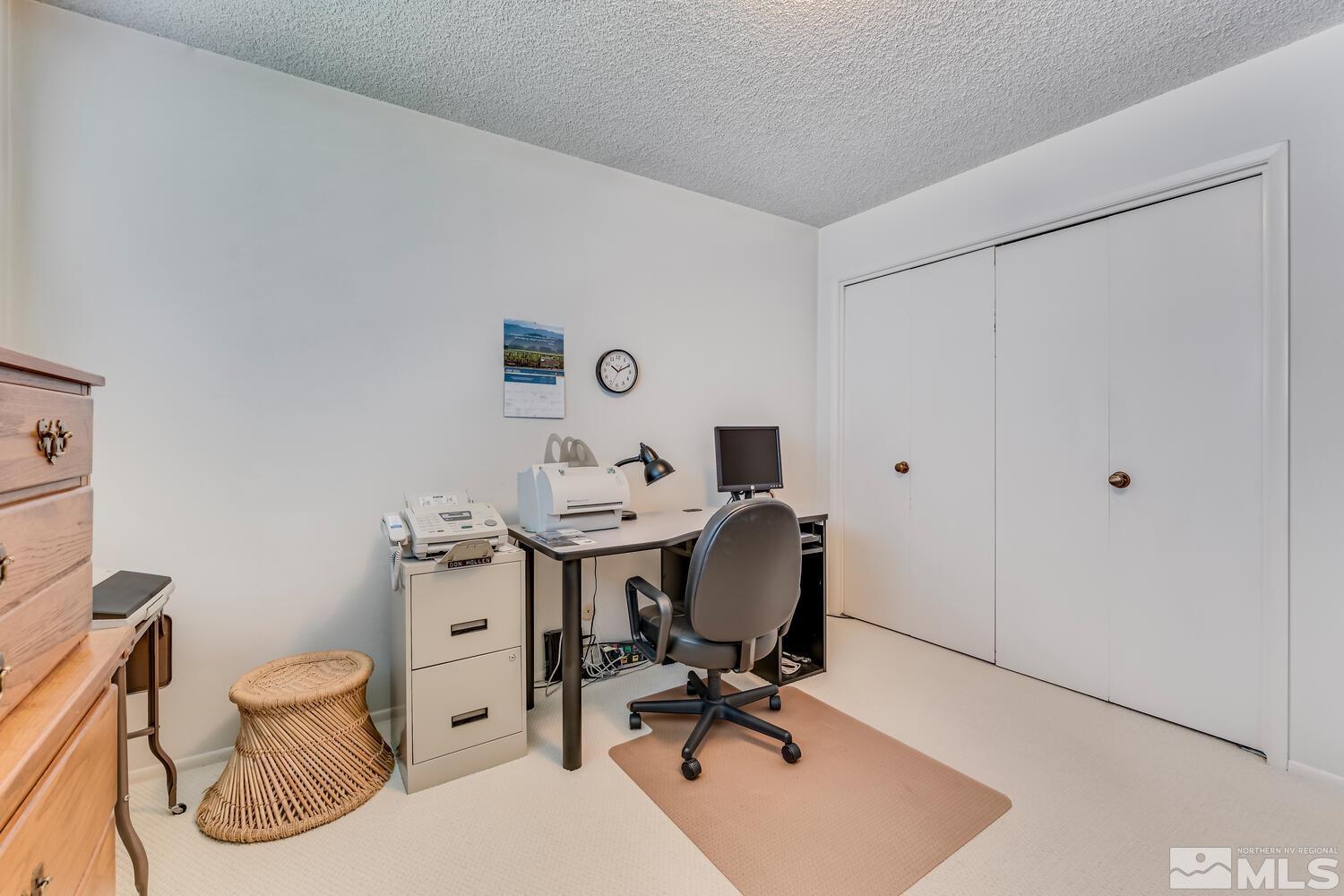 1290 Belford Road Reno, NV 89509 - Photo 24 of 33 a view of a workspace with furniture and a bathroom