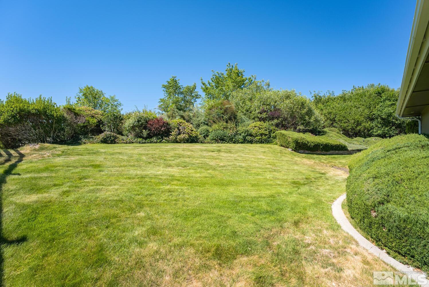 1290 Belford Road Reno, NV 89509 - Photo 32 of 33 a view of a yard with a house in the background