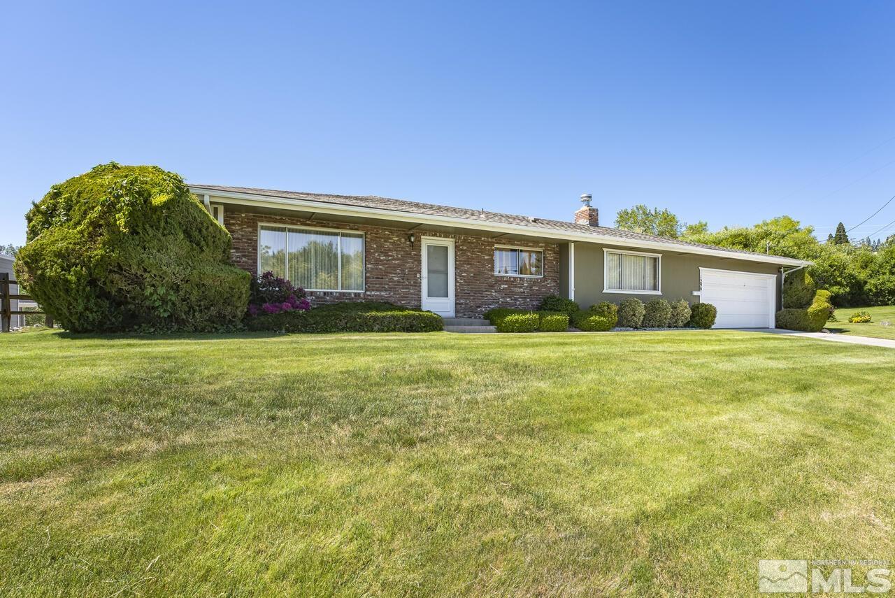 1290 Belford Road Reno, NV 89509 - Photo 4 of 33 a front view of house with yard and green space