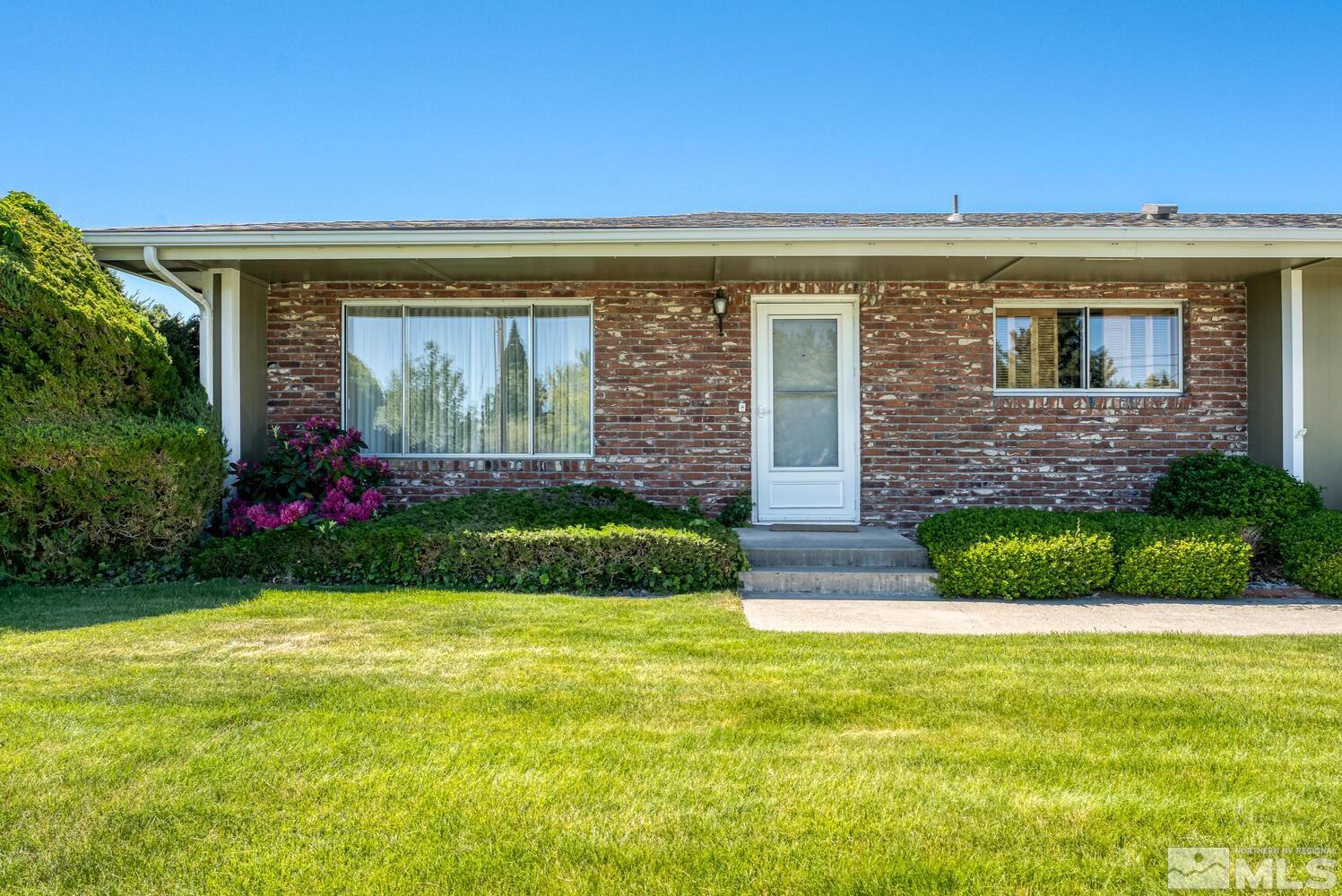 1290 Belford Road Reno, NV 89509 - Photo 5 of 33 a front view of a house with a yard