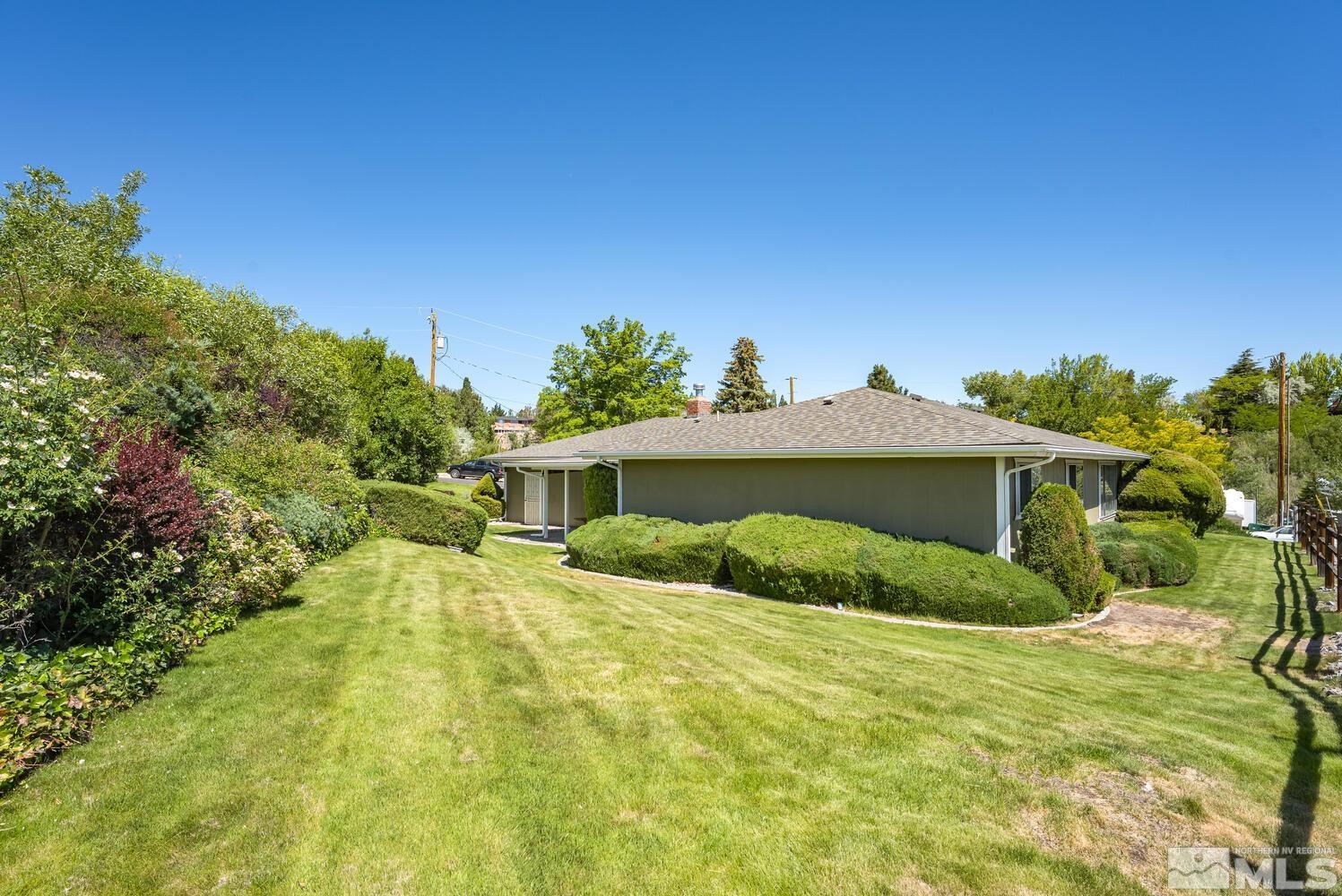1290 Belford Road Reno, NV 89509 - Photo 6 of 33 a view of a house with a yard