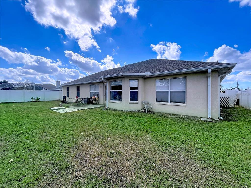 4372 Odin Street Spring Hill, FL 34608 - Photo 15 of 38 a view of a house with a yard