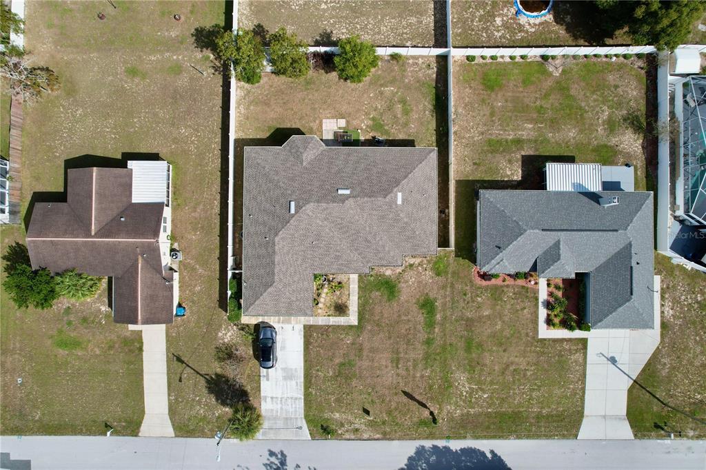 4372 Odin Street Spring Hill, FL 34608 - Photo 2 of 38 an aerial view of a house with a yard