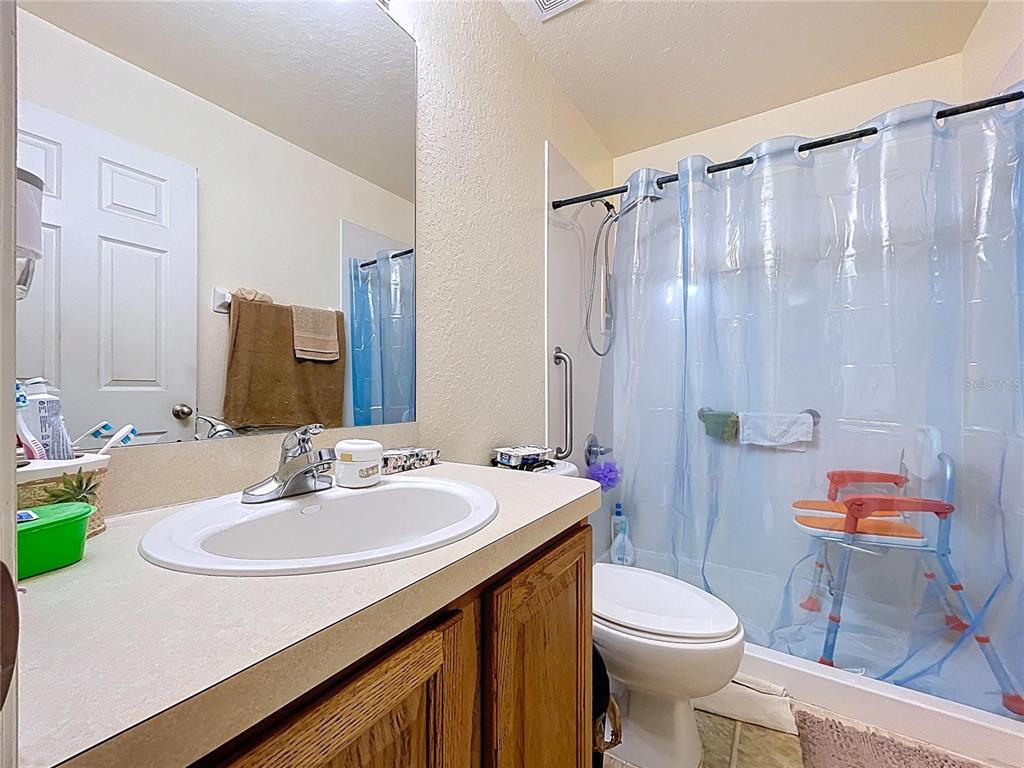 4372 Odin Street Spring Hill, FL 34608 - Photo 23 of 38 a bathroom with a sink toilet and shower
