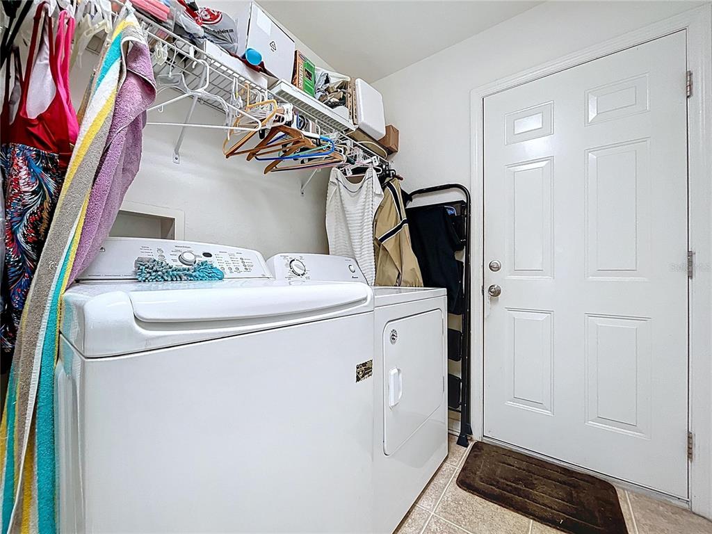 4372 Odin Street Spring Hill, FL 34608 - Photo 26 of 38 a utility room with dryer and washer