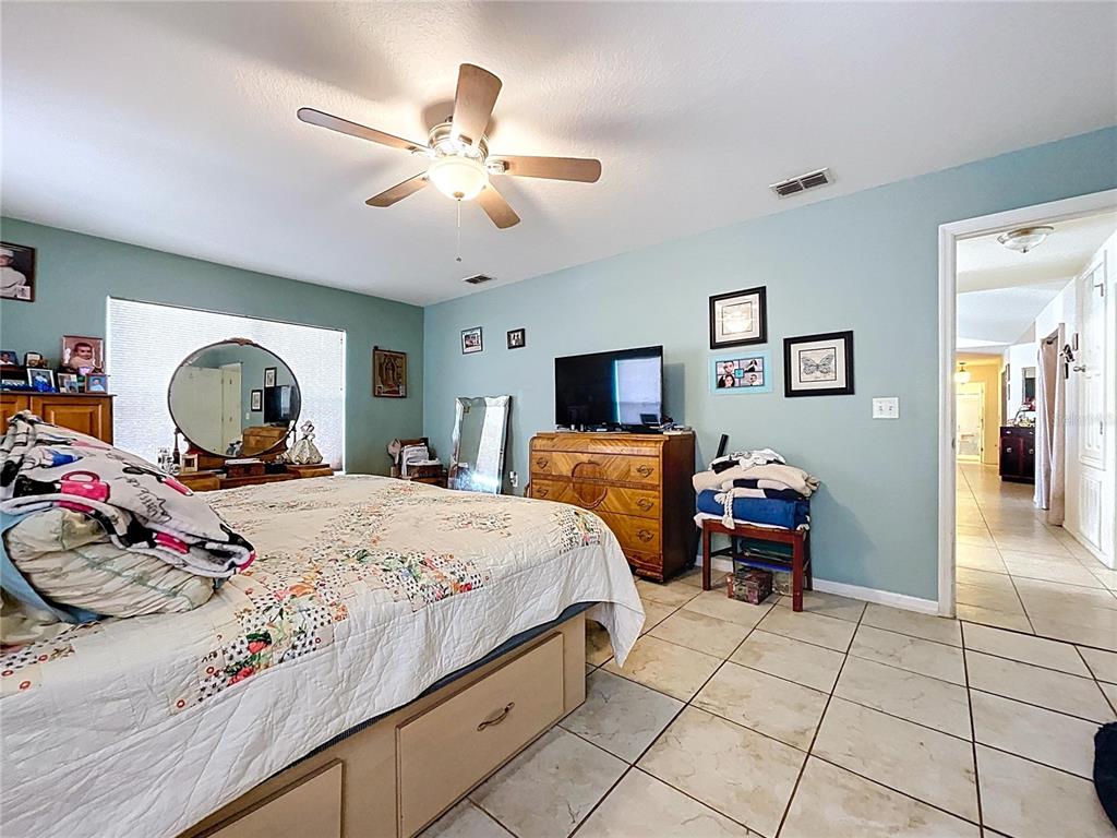 4372 Odin Street Spring Hill, FL 34608 - Photo 30 of 38 a bedroom with bed and window