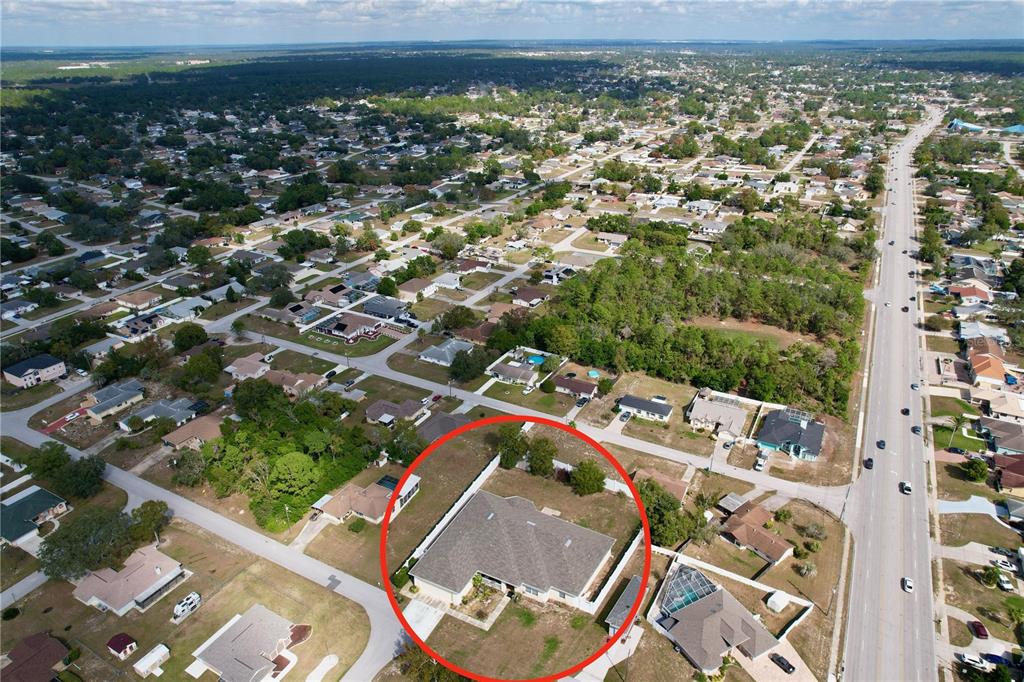 4372 Odin Street Spring Hill, FL 34608 - Photo 34 of 38 an aerial view of residential houses with outdoor space