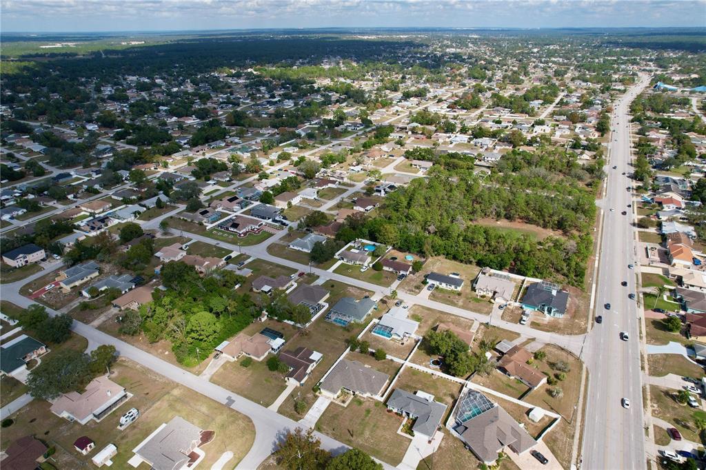 4372 Odin Street Spring Hill, FL 34608 - Photo 35 of 38 an aerial view of residential houses with outdoor space