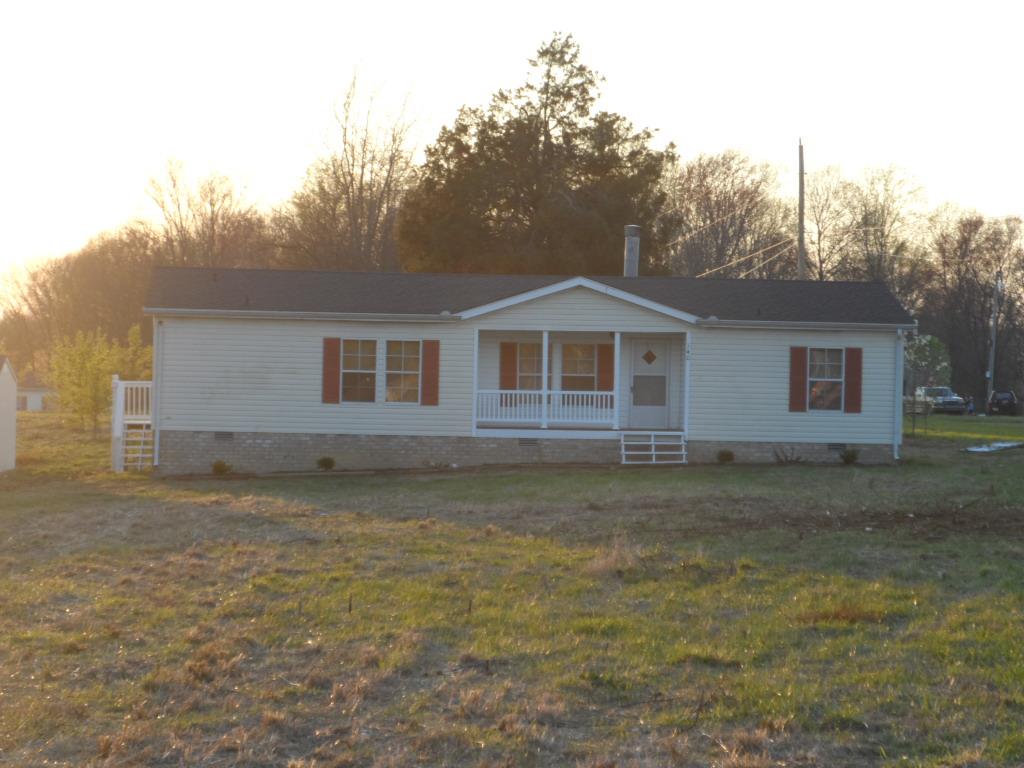 140 East Biggs Road Portland, TN 37148 - Photo 1 of 10 a front view of a house with a garden