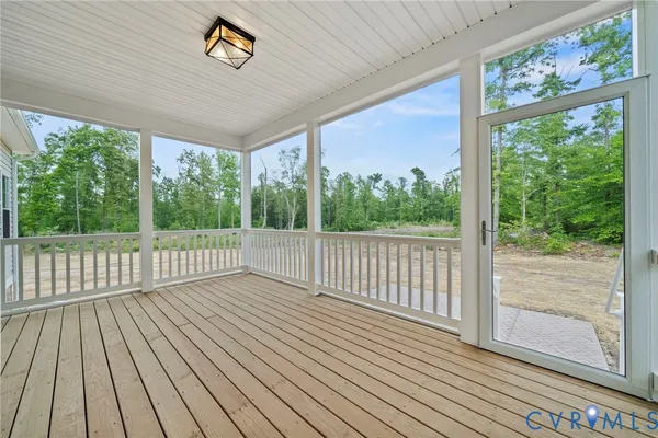 a view of a balcony with wooden floor
