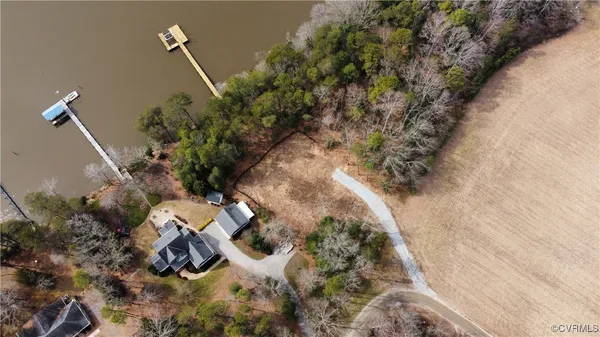 a view of a house with a yard and tree s