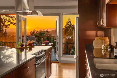 a view of a kitchen with a large window