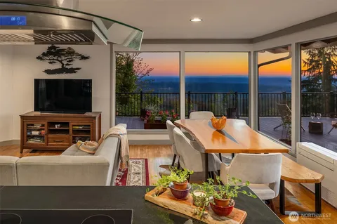 a outdoor living space with furniture tv and a fireplace