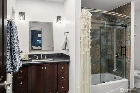 a bathroom with a bathtub and a sink