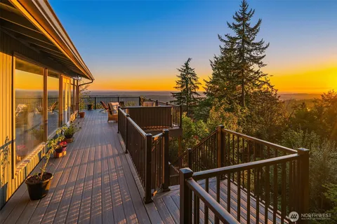 a view of balcony with couch and wooden floor