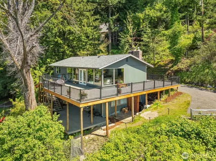 an aerial view of a house with a swimming pool
