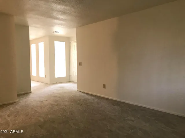a view of empty room with windows