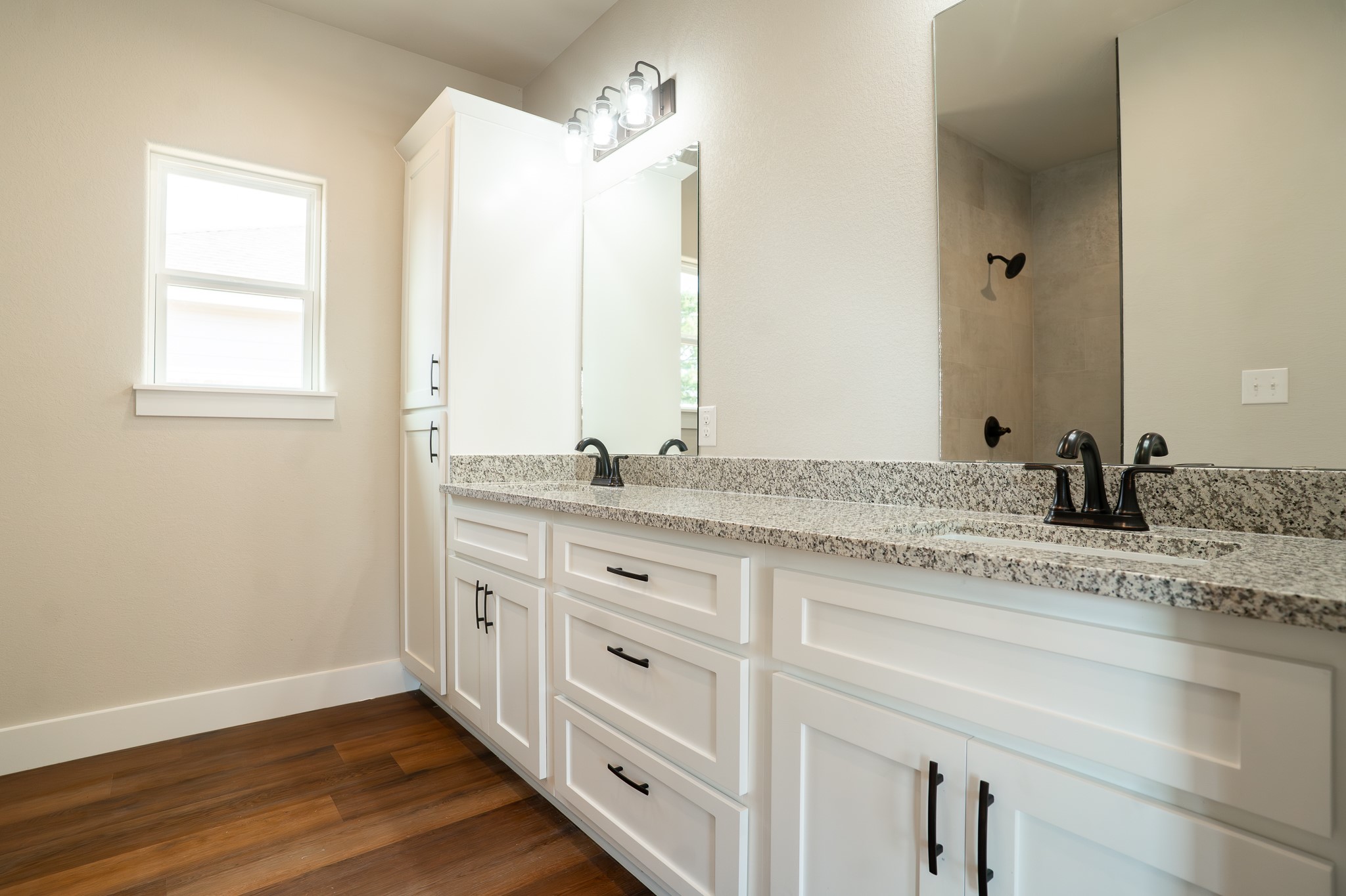 305 String Prairie Way Smithville, TX 78957 - Photo 13 of 26 a bathroom with a granite countertop sink and a mirror