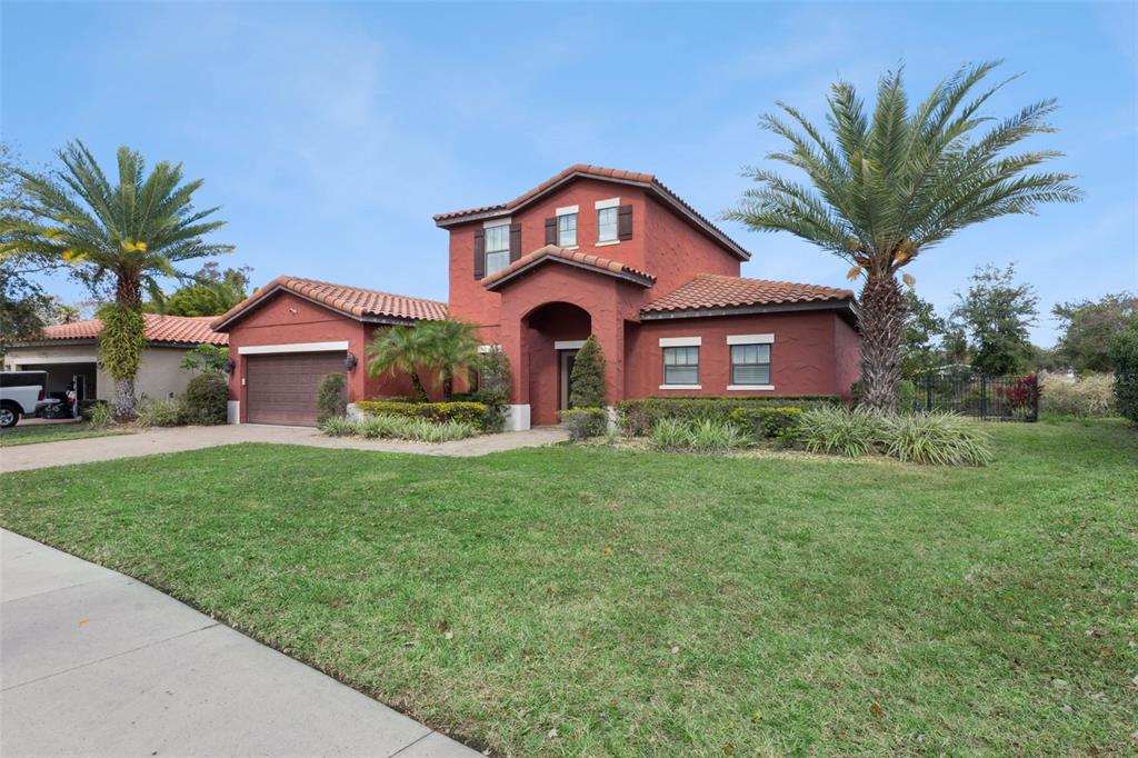 a front view of a house with a yard and garage