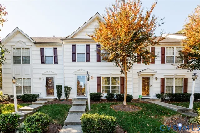 front view of a house with a yard