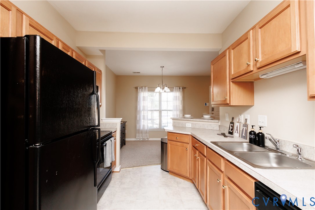 405 Hollybrook Ridge Lane Richmond, VA 23223 - Photo 11 of 37 a kitchen with stainless steel appliances granite countertop a refrigerator a sink dishwasher a stove and a microwave oven