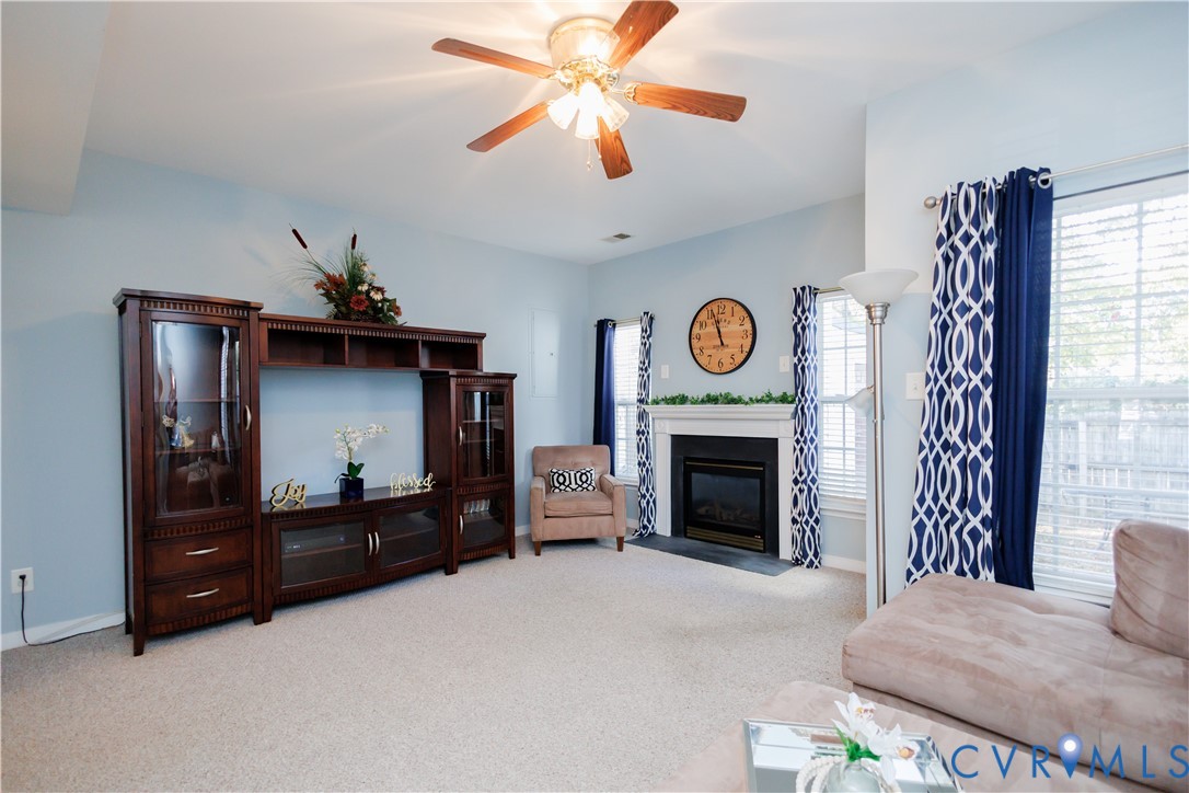 405 Hollybrook Ridge Lane Richmond, VA 23223 - Photo 14 of 37 a bedroom with a bed and a fireplace