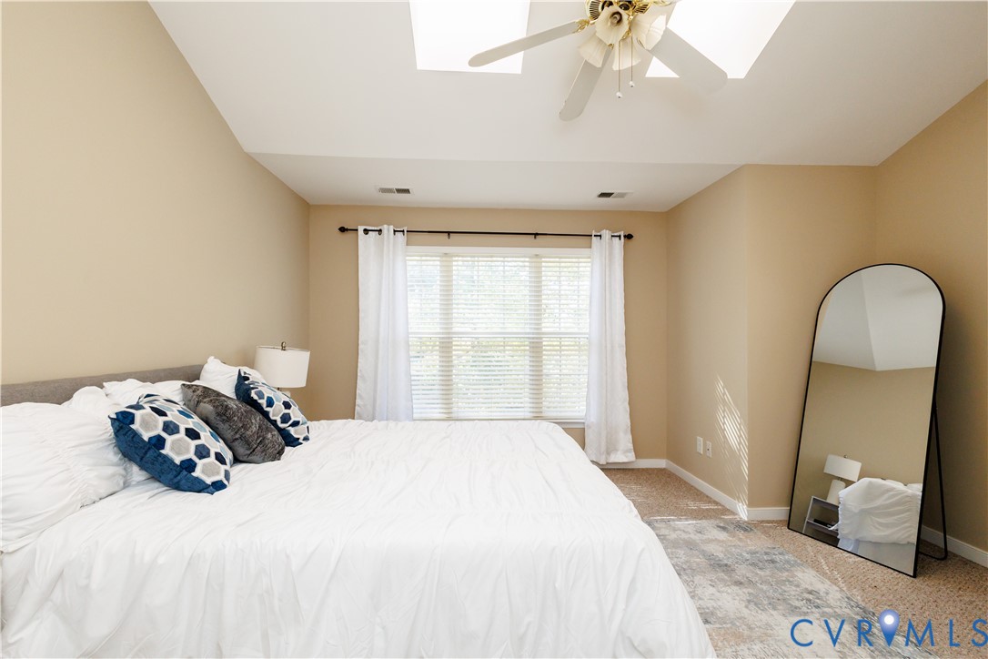 405 Hollybrook Ridge Lane Richmond, VA 23223 - Photo 19 of 37 a bedroom with a bed and a window