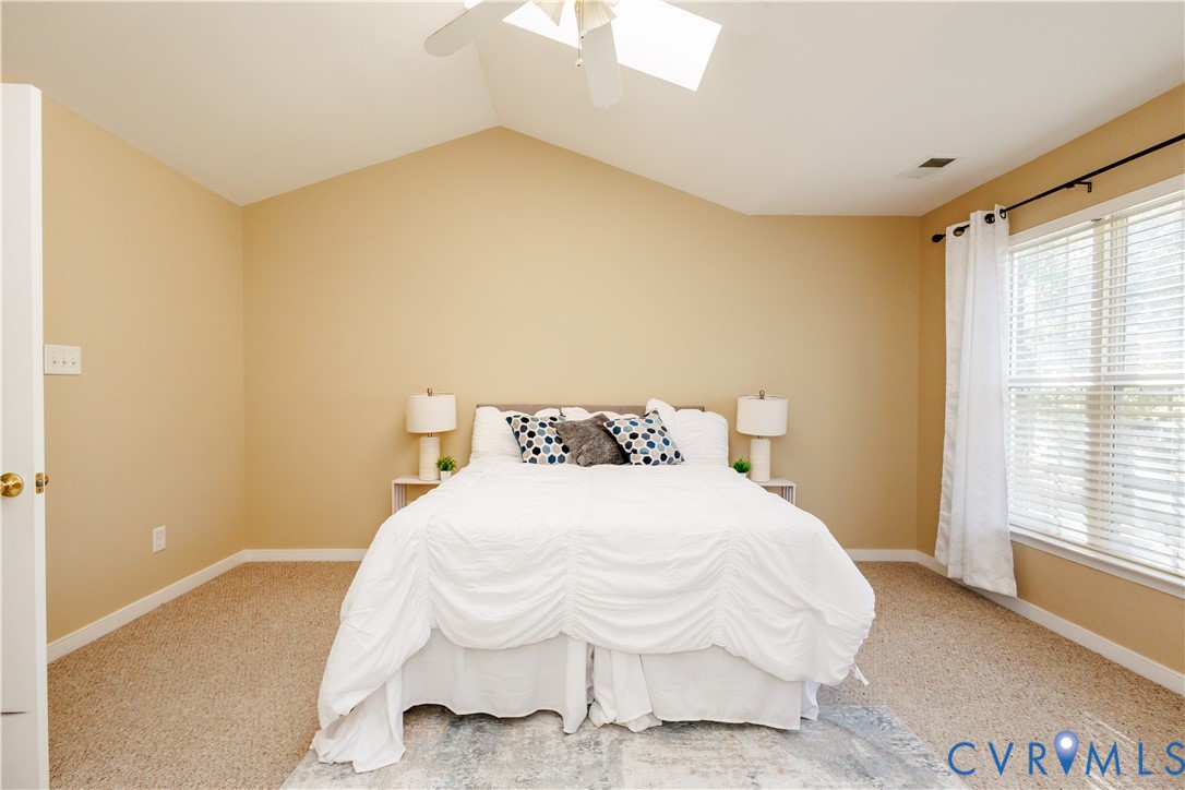 405 Hollybrook Ridge Lane Richmond, VA 23223 - Photo 21 of 37 a bedroom with a bed and a window with outer view