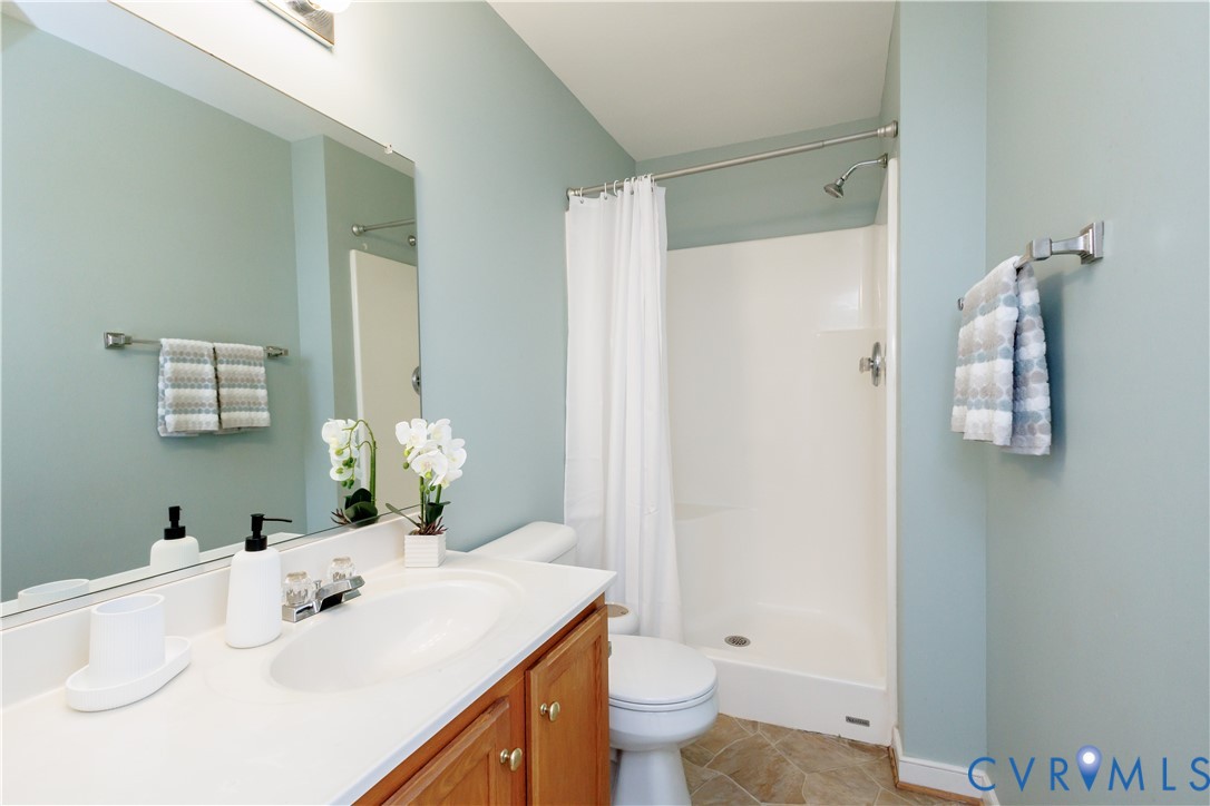 405 Hollybrook Ridge Lane Richmond, VA 23223 - Photo 26 of 37 a bathroom with a sink toilet and shower