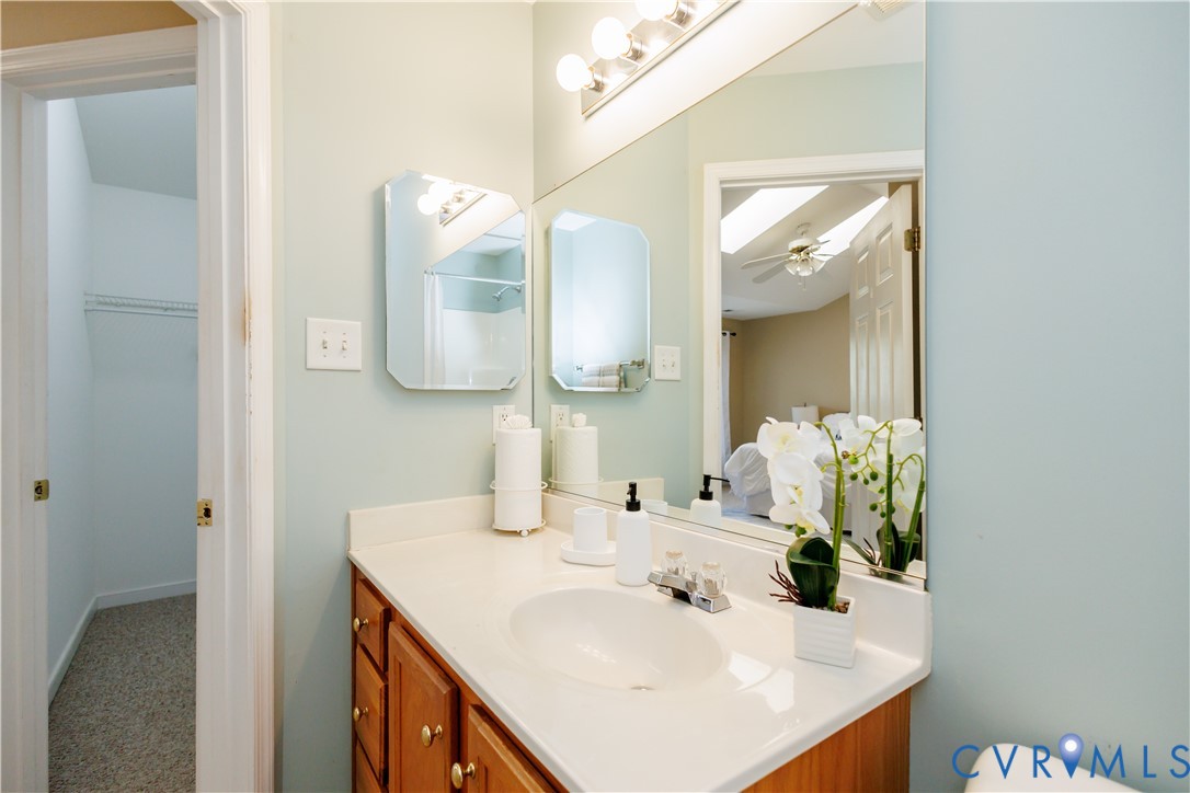 405 Hollybrook Ridge Lane Richmond, VA 23223 - Photo 28 of 37 a bathroom with a sink and a mirror