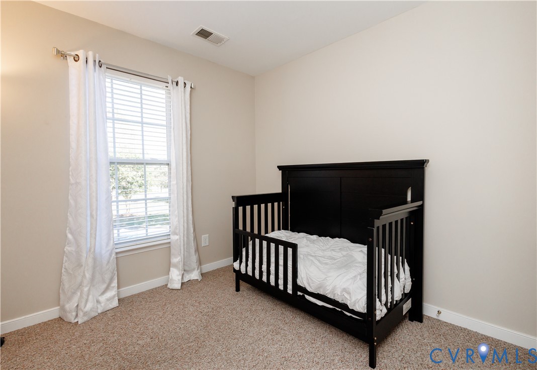 405 Hollybrook Ridge Lane Richmond, VA 23223 - Photo 31 of 37 a view of staircase with white walls and a window