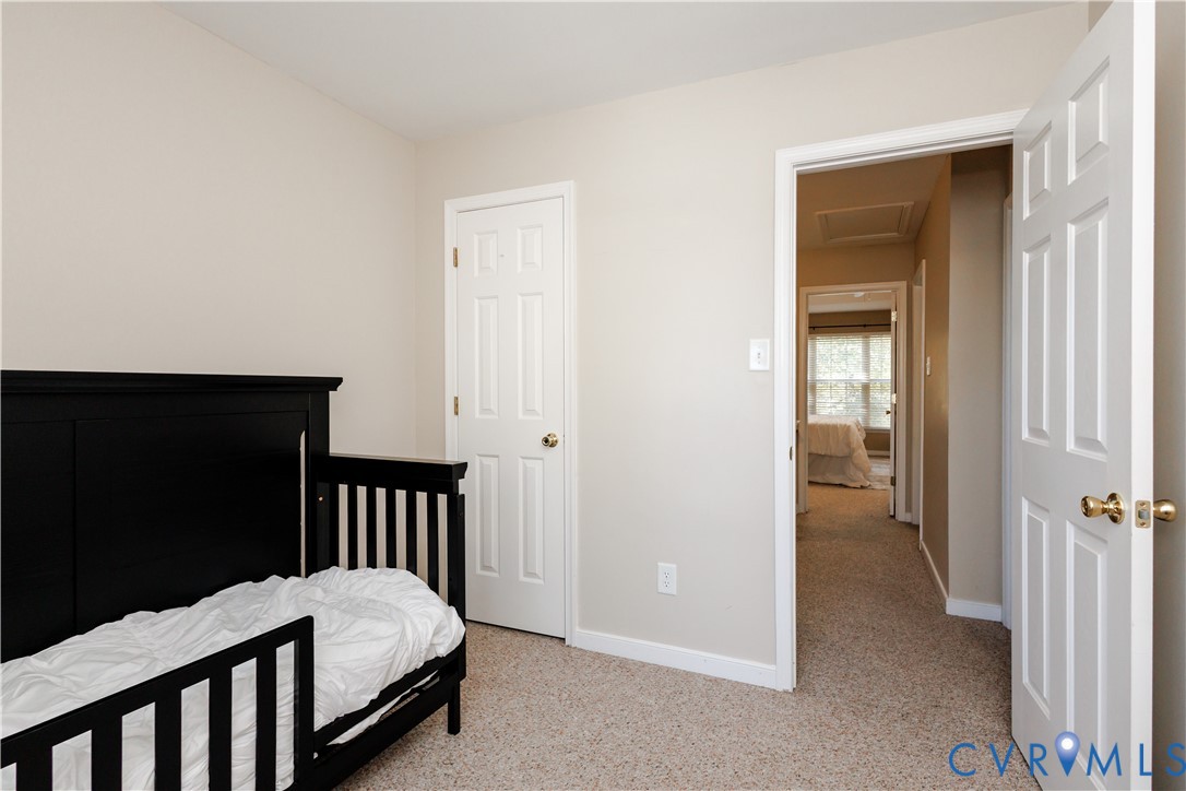 405 Hollybrook Ridge Lane Richmond, VA 23223 - Photo 32 of 37 a bedroom with a bed