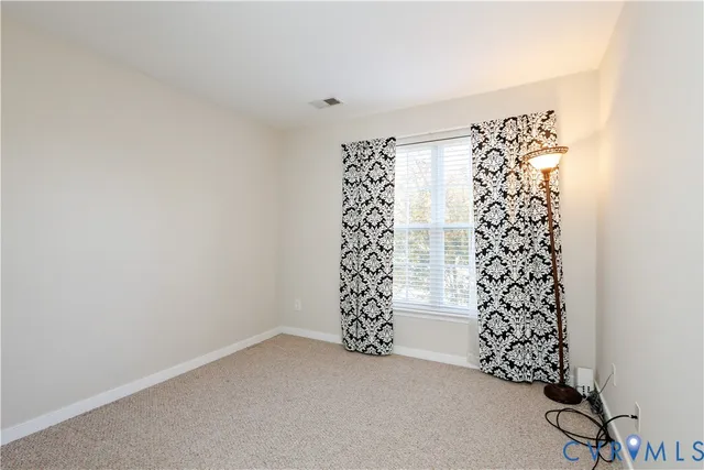 a view of a big room with windows