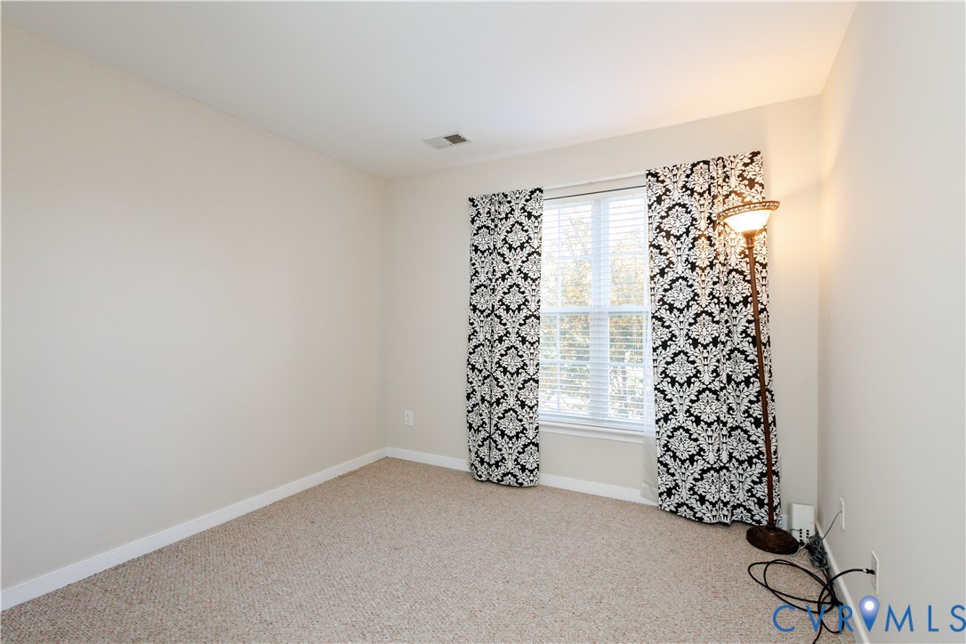 405 Hollybrook Ridge Lane Richmond, VA 23223 - Photo 34 of 37 a view of a big room with windows