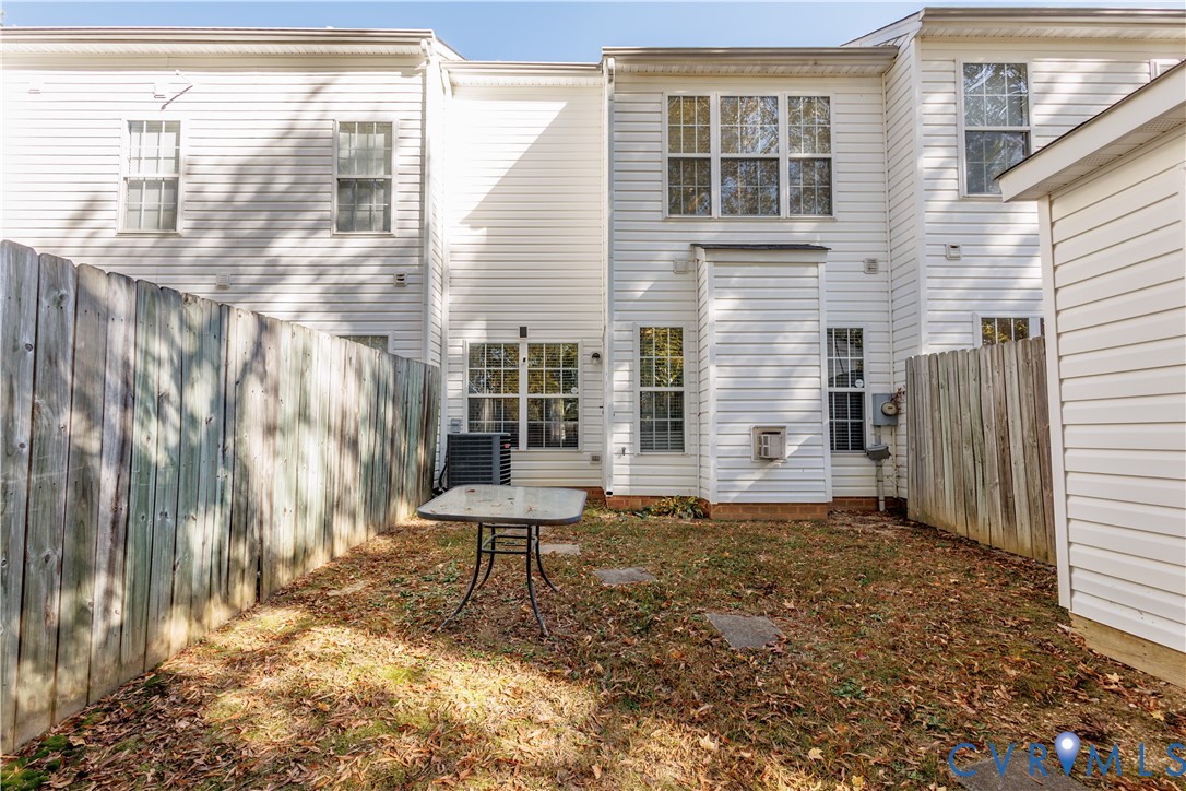 405 Hollybrook Ridge Lane Richmond, VA 23223 - Photo 36 of 37 a backyard of a house with table and chairs