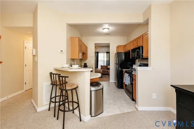a view of a kitchen and dining room