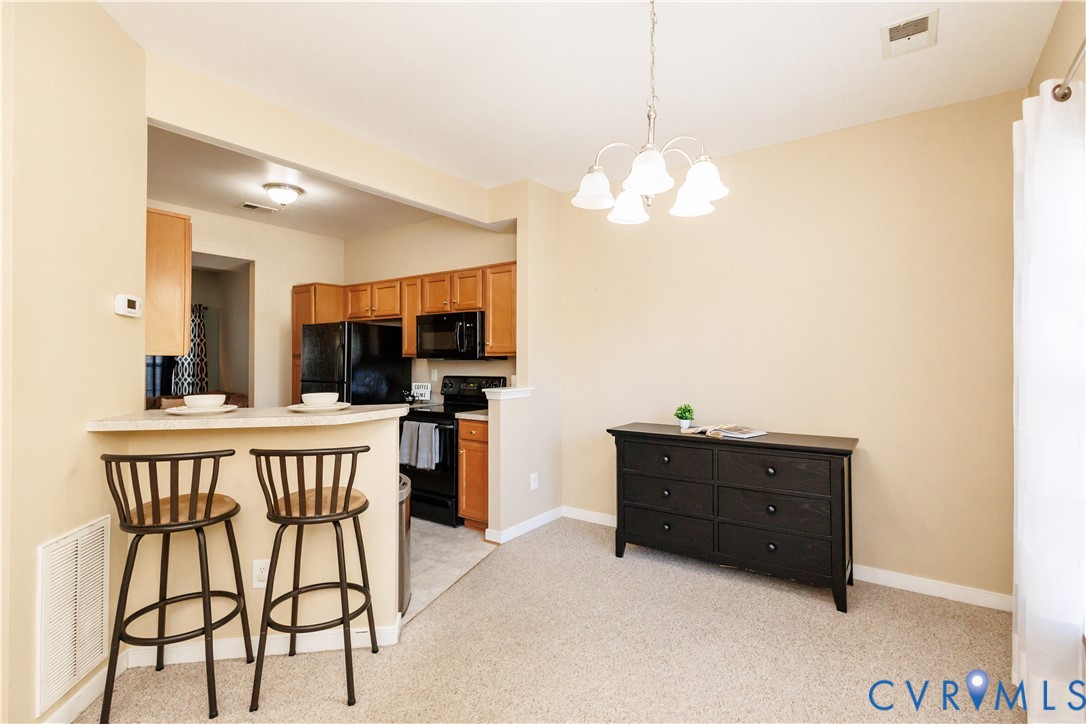 405 Hollybrook Ridge Lane Richmond, VA 23223 - Photo 5 of 37 a dining room with furniture and window