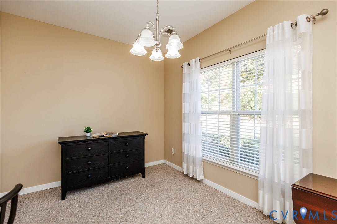 405 Hollybrook Ridge Lane Richmond, VA 23223 - Photo 6 of 37 a room that has a dresser and a window