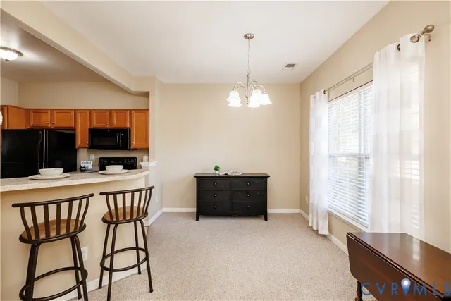 a view of a livingroom with furniture window and wooden floor