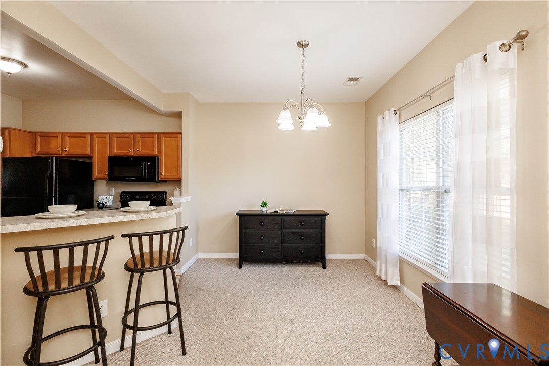 405 Hollybrook Ridge Lane Richmond, VA 23223 - Photo 7 of 37 a view of a livingroom with furniture window and wooden floor