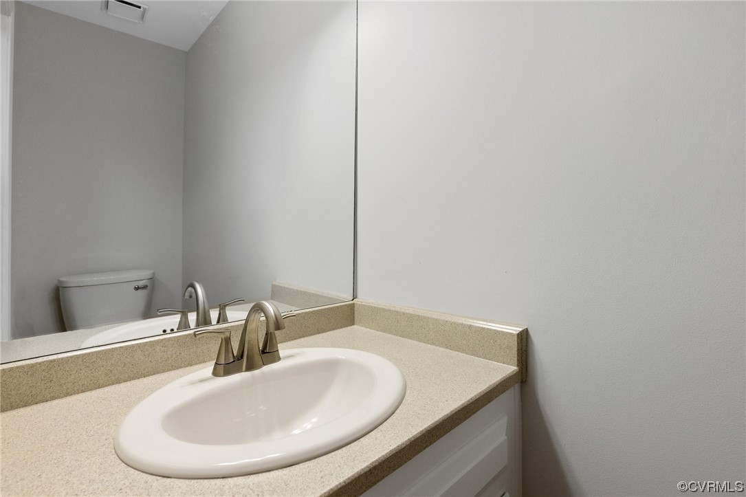 507 Rivers Bend Circle Chester, VA 23836 - Photo 35 of 41 a bathroom with a sink and a mirror