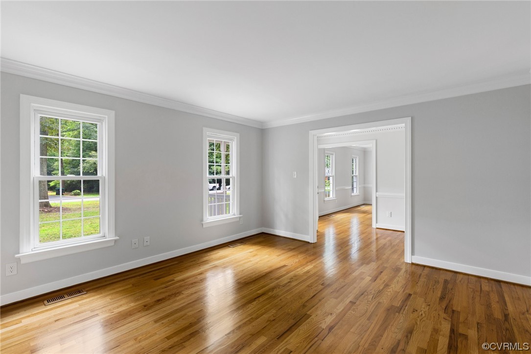 507 Rivers Bend Circle Chester, VA 23836 - Photo 5 of 41 a view of an empty room with wooden floor and a window