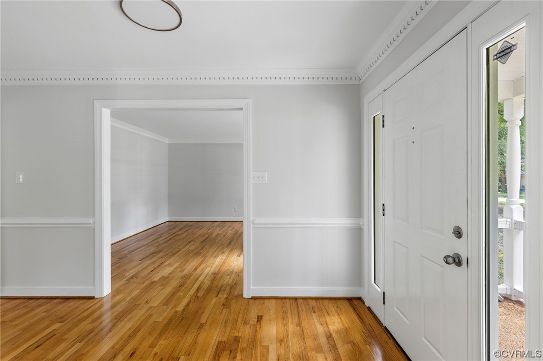 507 Rivers Bend Circle Chester, VA 23836 - Photo 9 of 41 a view of a room with wooden floor and door